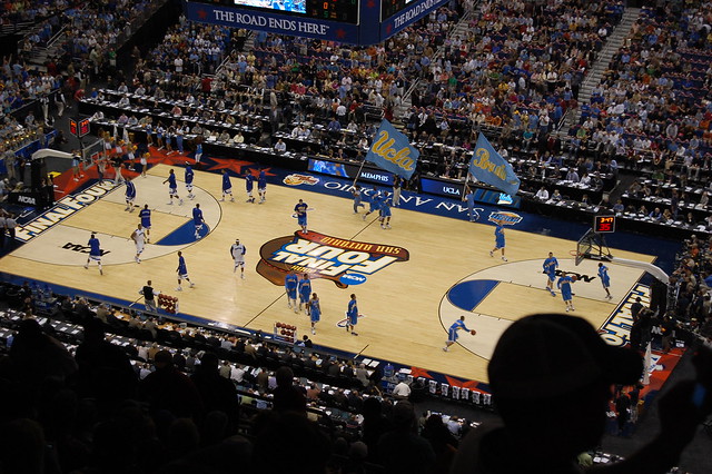 Photo of a basketball court with players for a final four ncaa championship game.
