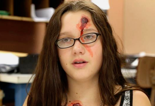 A student with stage makeup preparing for an "active shooter drill." Still from NBCNews