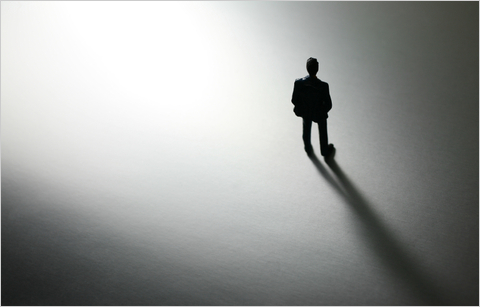 silhouette of a man standing alone.