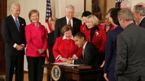 Obama signs his first piece of legislation, the Lilly Ledbetter Fair Pay Act, in January 2009. (U.S. Government Photo)
