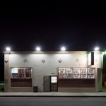 A southwest side party store illuminates its area. © David Schalliol.