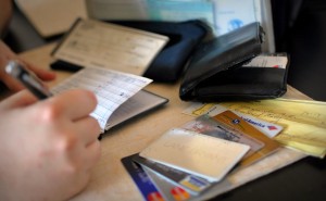 Using MasterCard to pay Visa. Photo by Morgan Via Flickr CC.