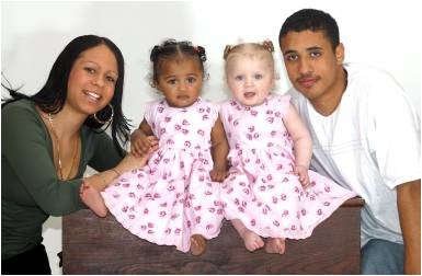 Mixed couple with black and white twins