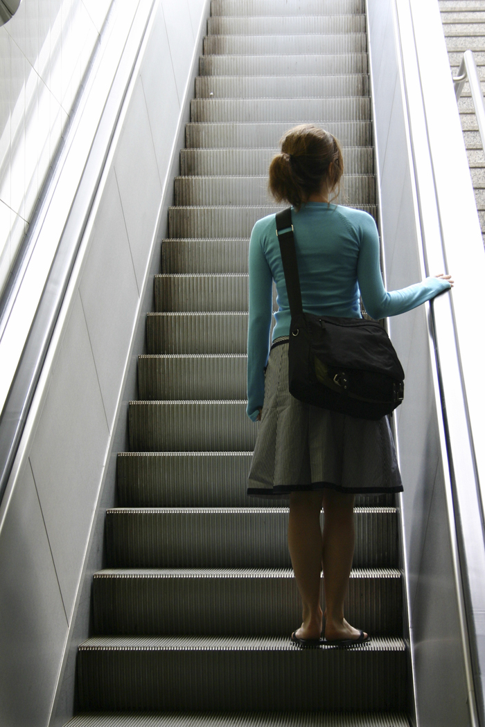 Woman on Elevator - Sociology Lens