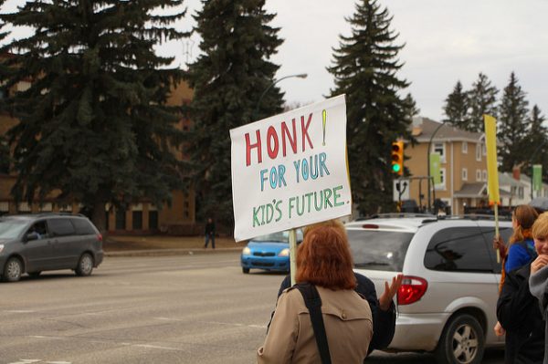 Image of a sign that reads, "honk for your kid's future"